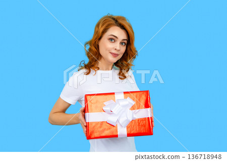 Holidays and celebration. Women with gift concept. Portrait of woman hold gift box. Girl celebrating birthday and receive presents. Girl celebrate 8-march, 14-february day, womans day, mothers day. Holidays and celebration. Women with gift concept. Portrait of woman hold gift box. Girl celebrating birthday and receive presents. Girl celebrate 8-march, 14-february day, womans day, mothers day. 136718948