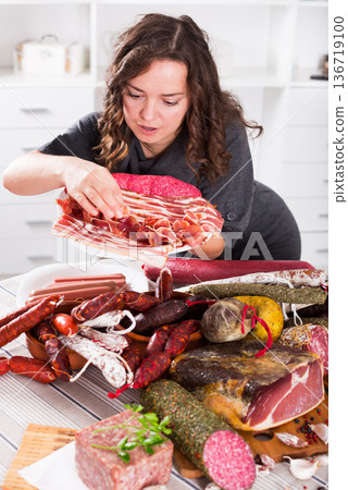 Girl with jamon and sausage Girl with jamon and sausage 136719100