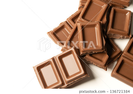 Stacked chocolate bars on white background 136721384