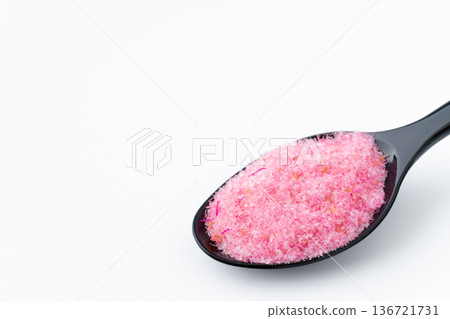 Close-up of cherry denbu on a spoon on a white background Close-up of cherry denbu on a spoon on a white background 136721731