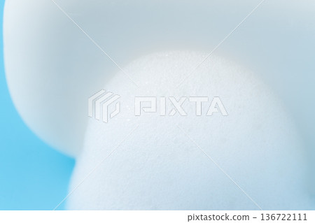 Close-up of lathered white bar soap on a light blue background Close-up of lathered white bar soap on a light blue background 136722111