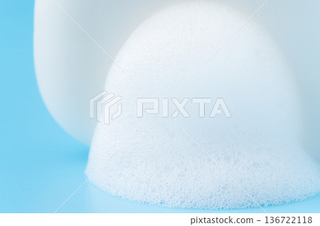 Close-up of lathered white bar soap on a light blue background Close-up of lathered white bar soap on a light blue background 136722118