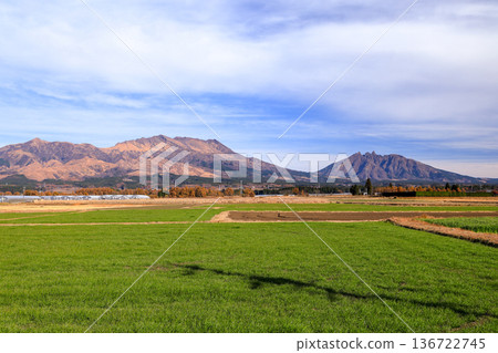 View of Mt. Nekodake and Mt. Takadake across the rural landscape of Minamiaso, Kumamoto Prefecture 136722745
