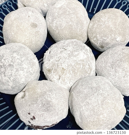 Mochi is a Japanese cake made from glutinous rice, pounded until it is soft and sticky, then shaped into a round shape. Various colors of mochi cake, traditional Japanese food Mochi is a Japanese cake made from glutinous rice, pounded until it is soft and sticky, then shaped into a round shape. Various colors of mochi cake, traditional Japanese food 136723130