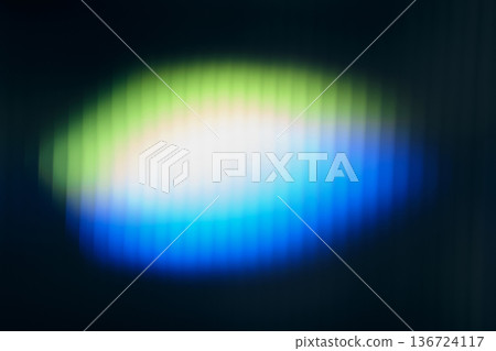 glowing light creating vibrant green, white and blue gradient pattern on blurred ribbed glass glowing light creating vibrant green, white and blue gradient pattern on blurred ribbed glass 136724117