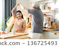 Asia happy older senior elderly couple dance waltz after cooking at kitchen room. 136725493