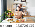 Asia happy senior elderly couple hugging and embrace at kitchen room.   136726135