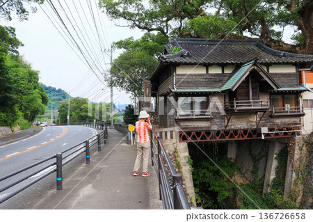 Water shrine and people located across from Esu Hachimangu Shrine in Asakura City, Fukuoka Prefecture 136726658