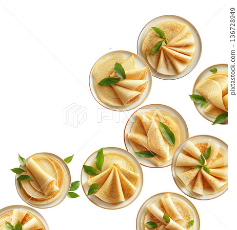 Multiple plates of folded golden crepes decorated with green leaves, top view isolated on white background, concept of food presentation Multiple plates of folded golden crepes decorated with green leaves, top view isolated on white background, concept of food presentation 136728949