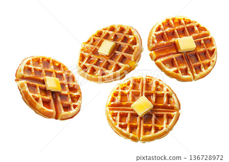 Delicious golden waffles topped with butter and syrup isolated on a white background. Concept of breakfast food Delicious golden waffles topped with butter and syrup isolated on a white background. Concept of breakfast food 136728972