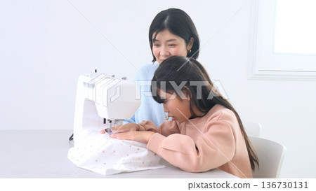 Family conversation sewing machine image Family conversation sewing machine image 136730131