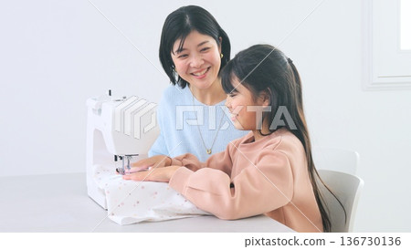 Family conversation sewing machine image Family conversation sewing machine image 136730136