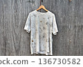 Dirty white t-shirt hanging on plywood 136730582