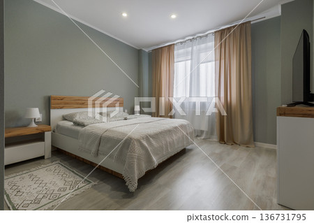 Modern Minimalist Bedroom with Sage Green Walls and Wooden Bed Modern Minimalist Bedroom with Sage Green Walls and Wooden Bed 136731795