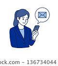 A female employee typing a work email 136734044