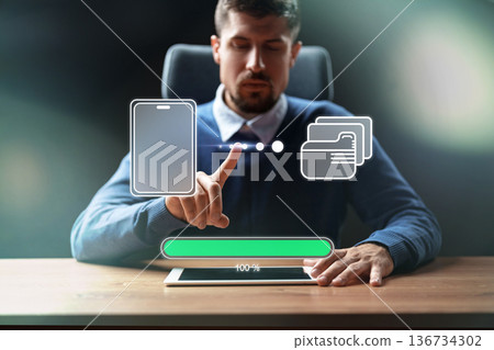 Man interacts with digital display for mobile payment process in office setting during daylight Man interacts with digital display for mobile payment process in office setting during daylight 136734302