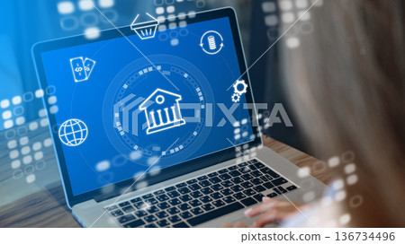 Invoice payment process on a laptop screen with banking graphics in a modern setting 136734496