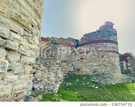 Ruins of ancient stone structure in open field under clear sky during daytime Ruins of ancient stone structure in open field under clear sky during daytime 136734718
