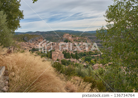 The medieval village of Alquezar, in the province of Huesca, with its clay roofs and its castle on the hilltop. The medieval village of Alquezar, in the province of Huesca, with its clay roofs and its castle on the hilltop. 136734764