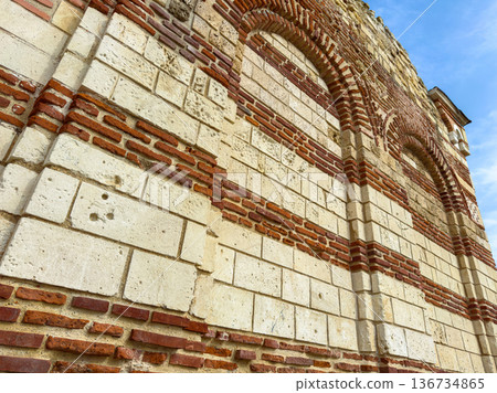 Building wall with red bricks and white stones at a historical location in bright daylight Building wall with red bricks and white stones at a historical location in bright daylight 136734865