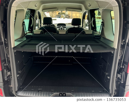 Cargo space in a van with seats removed for additional storage in a cold area during winter 136735053
