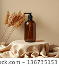 A black plastic bottle of cosmetics stands on a beige background. 136735153
