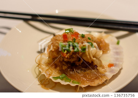 Steamed scallop on shell with vermicelli noodles and garlic Steamed scallop on shell with vermicelli noodles and garlic 136735756