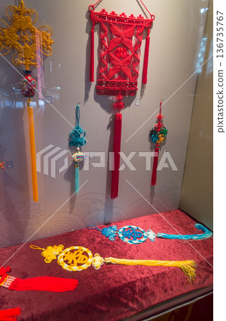 Traditional chinese knot tassel ornaments in museum display Traditional chinese knot tassel ornaments in museum display 136735767