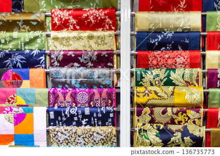 Colorful patterned silk fabric rolls on display Colorful patterned silk fabric rolls on display 136735773