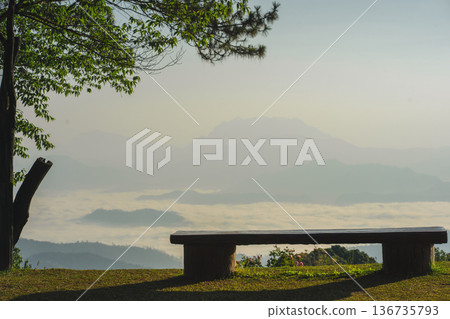 sunrise with man see moving of cloud and clear sky and layer of mountain sunrise with man see moving of cloud and clear sky and layer of mountain 136735793