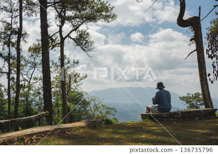 sunrise with man see moving of cloud and clear sky and layer of mountain sunrise with man see moving of cloud and clear sky and layer of mountain 136735796