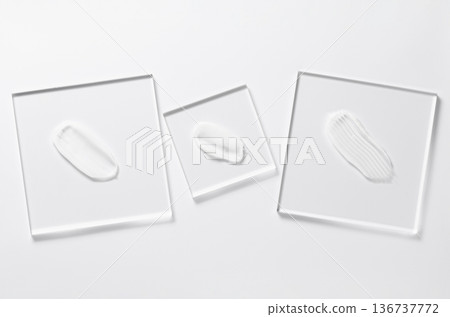 White cosmetic skin care product on glass. White background. 136737772