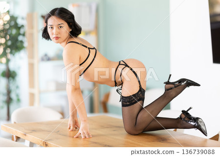 Seductive naked girl poses in stockings in university classroom 136739088