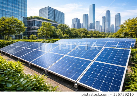 Solar panels installation in modern city park with skyline of skyscrapers in background 136739210