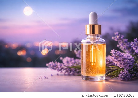 Natural essential oil dropper bottle with lavender flowers at sunset background Natural essential oil dropper bottle with lavender flowers at sunset background 136739263