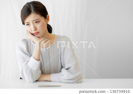 Thinking, worrying, stressed, troubled women Generative AI 136739910