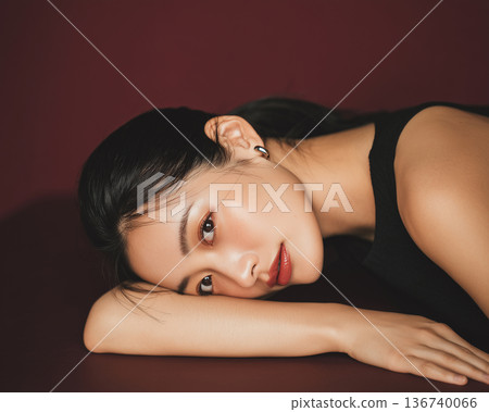 Dark background and woman in black dress 136740066