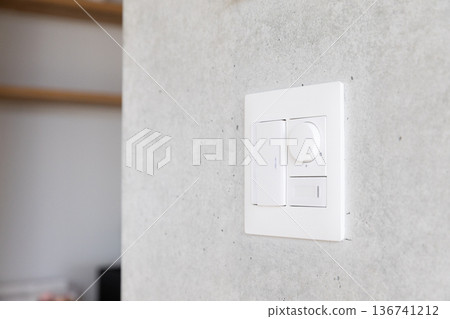 Switch on a concrete wall 136741212