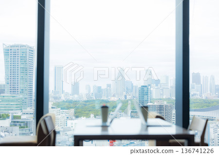 A scene with a computer in an office on a high floor 136741226