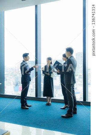 Business people standing and talking Business people standing and talking 136741314