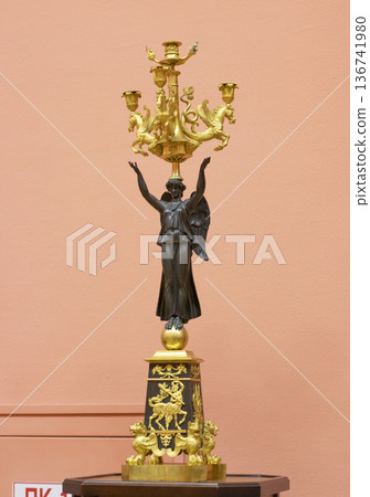 02.02.2026 - Minsk, Belarus -French Empire candelabrum, featuring a bronze figure of a winged Victory holding lighting elements on display of the museum 136741980