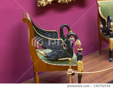 02.02.2026 - Minsk, Belarus - an antique Neoclassical or Empire-style fauteuil chair on display of the museum 136742038