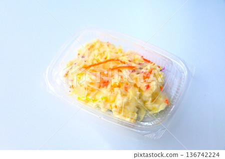 Potato salad in a plastic container Potato salad in a plastic container 136742224