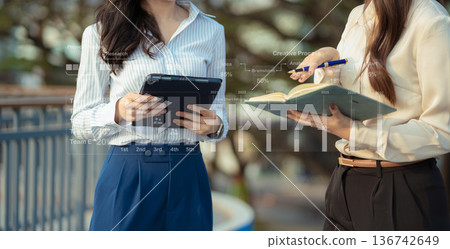 Project manager working and update tasks with milestones progress planning and professional investor working new start up project. Project manager working and update tasks with milestones progress planning and professional investor working new start up project. 136742649
