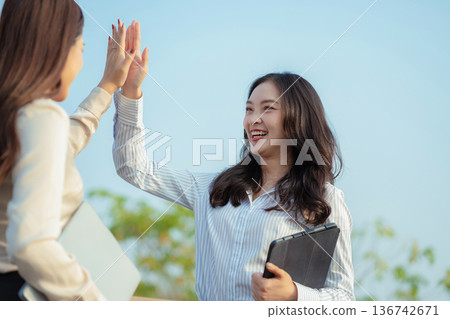 Happy creative business people are motivated, giving high five and celebration successful deal. Cooperation Meeting Partnership Career growth Team building Successful business. Happy creative business people are motivated, giving high five and celebration successful deal. Cooperation Meeting Partnership Career growth Team building Successful business. 136742671
