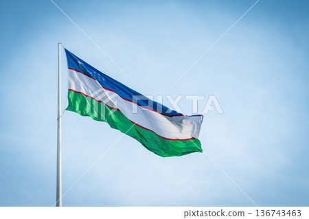 Uzbekistan Flag Waving in Blue Sky, National Symbol of Uzbekistan 136743463