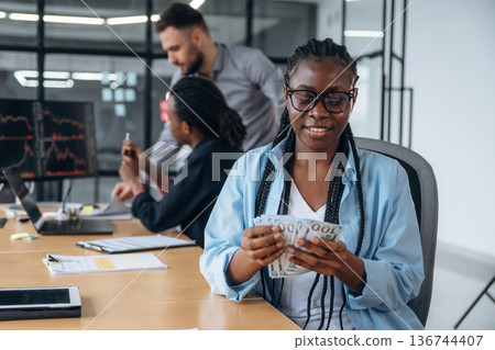 Counting the currency. Business people are working in the office 136744407