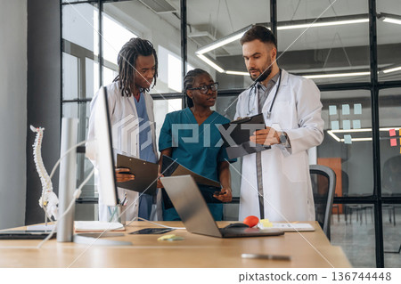Doctors are working in the office Doctors are working in the office 136744448