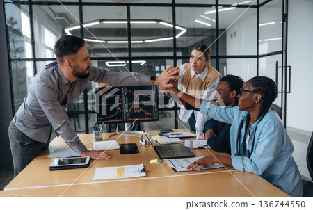 In conference room by the table. Business people are working in the office 136744550