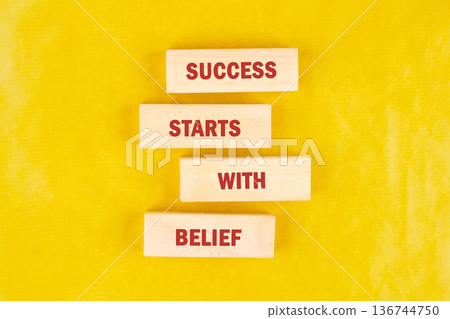 A motivational statement presented with wooden blocks, forming an ascending line on a brilliant yellow surface, highlighting the power of self-trust A motivational statement presented with wooden blocks, forming an ascending line on a brilliant yellow surface, highlighting the power of self-trust 136744750
